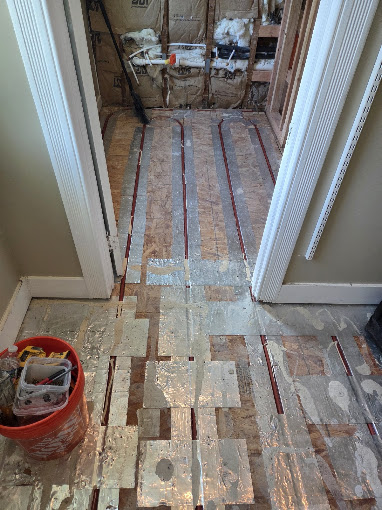 Radiant bathroom floor installation in progress