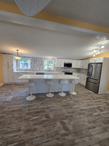 Finished open kitchen by Romeo's Contracting