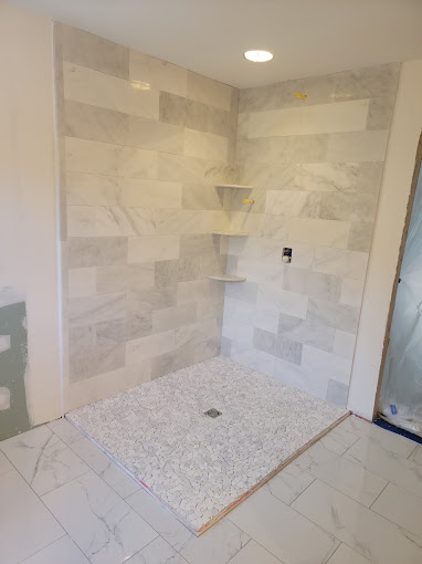 Custom shower tile installation in progress